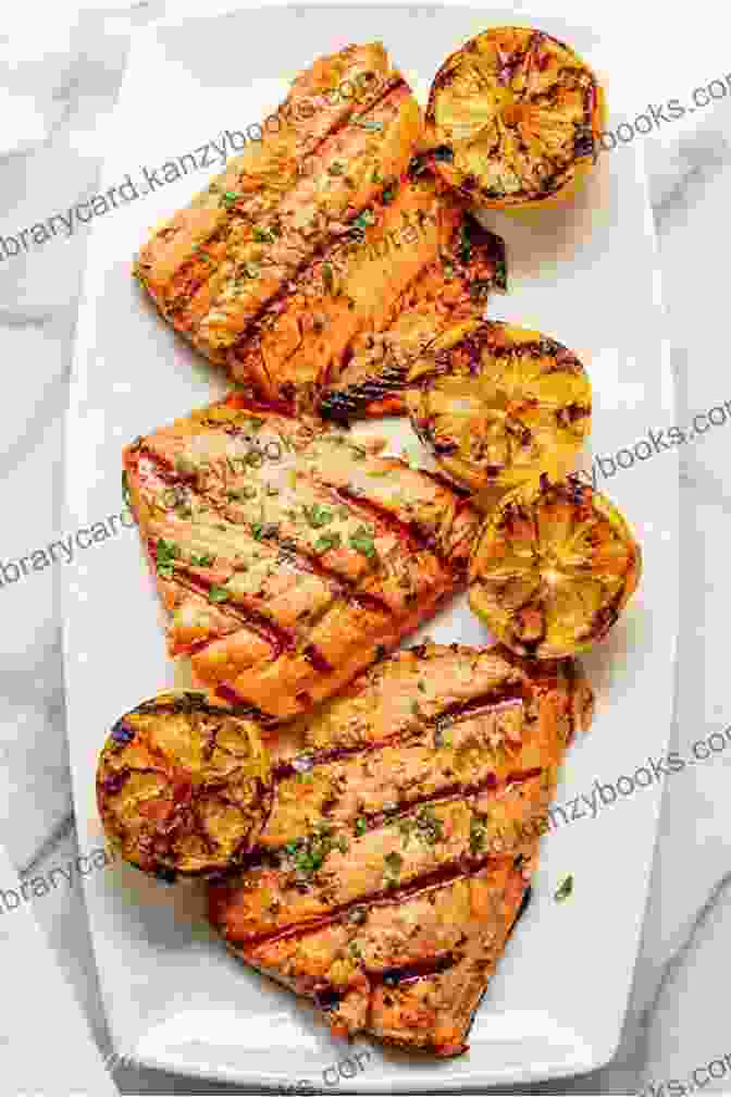 A Juicy Grilled Salmon Fillet Topped With Lemon Wedges And Herbs Cooking With Olive Oil 2: Simply Delicious Olive Oil Cooking With Over 50 Olive Oil Recipes